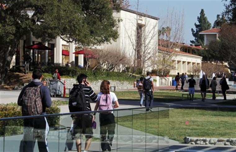 In this Thursday, Feb. 2, 2012 photo, students walk through the campus of Claremont McKenna College in Claremont, Calif.